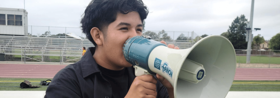 image of student holding a microphone
