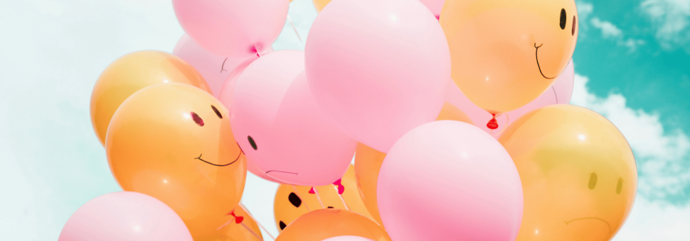 image of balloons with happy and sad faces